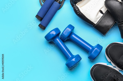 Set of sport equipment on color background