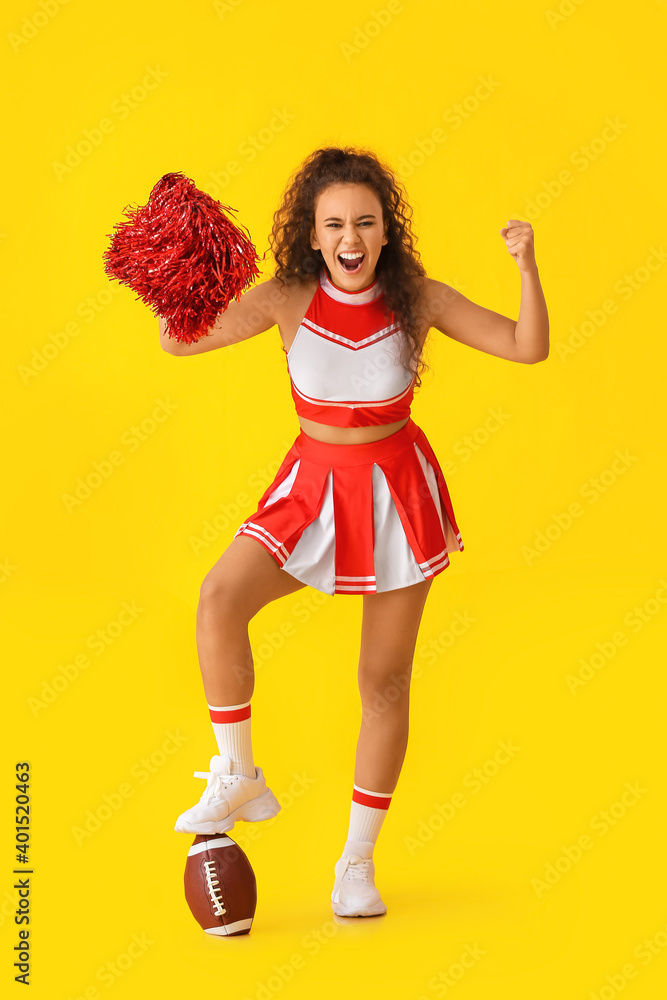 Emotional cheerleader with ball on color background Emotional cheerleader with ball on color background
