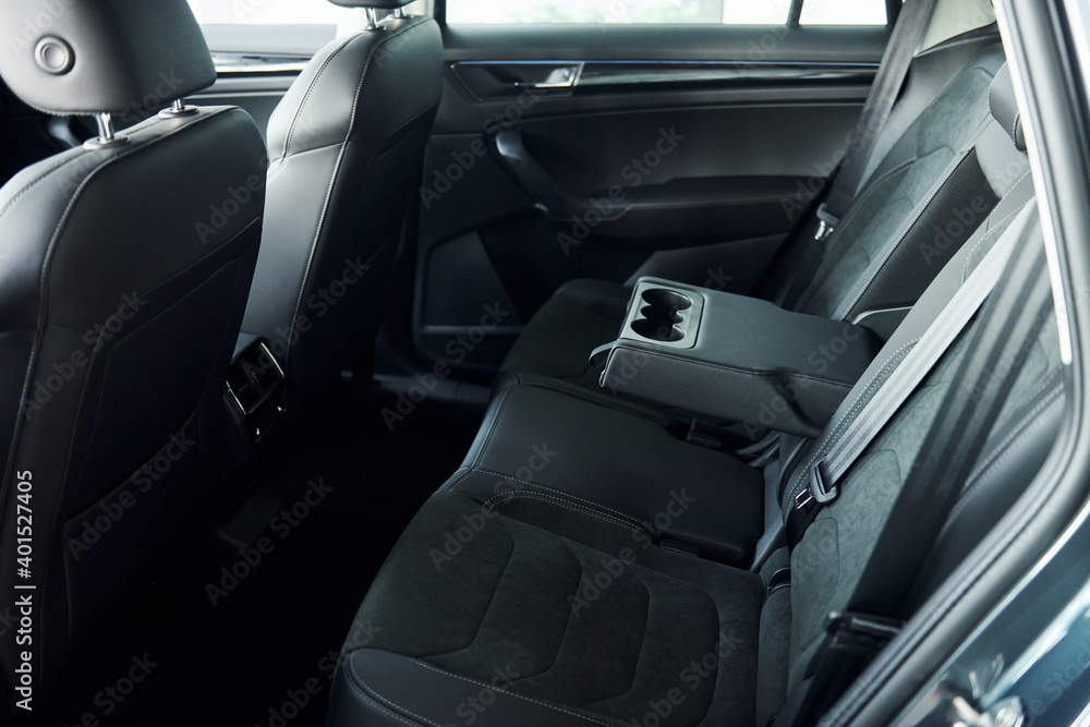 Comfortable seats. Close up focused view of brand new modern black automobile Comfortable seats. Close up focused view of brand new modern black automobile