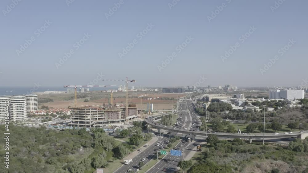 Aerial view of Tel Aviv Glilot highway interchange with traffic in all directions.
Aerial view of Tel Aviv Glilot highway interchange with traffic in all directions.