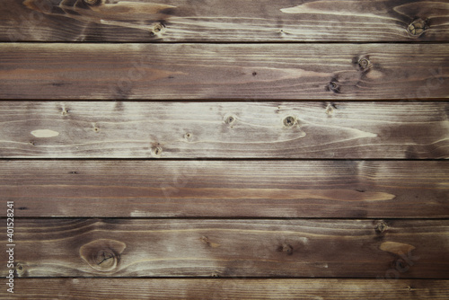 View on old vintage natural wooden brown board with horizontal lines of planks and knotholes