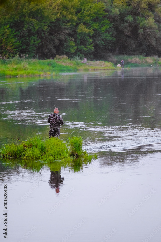 A man near the water. Fishing on the river