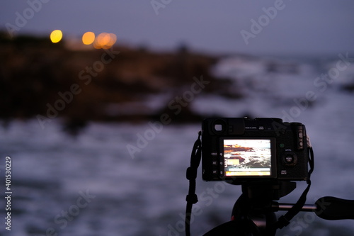 A camera taking a picture of the coast in Brittany. France, december 2020.