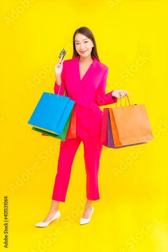 Portrait beautiful young asian woman with colorful shopping bag