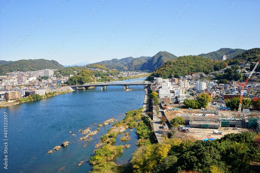Fototapeta premium Landscape of Kiso River and Inuyama City from Inuyama Castle in Inuyama City, Aichi, Japan - 犬山城からの木曽川