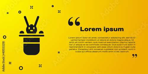 Black Magician hat and rabbit icon isolated on yellow background. Magic trick. Mystery entertainment concept. Vector.