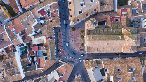 Top view of christian cathedral church in Spain. Aerial top view from above of central square in the Andalusian Spanish town of Antequera with big church