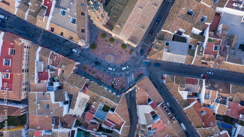 Top view of christian cathedral church in Spain. Central town square in front of cathedral seen from above aerial view of city centre in Andalusia, Spain