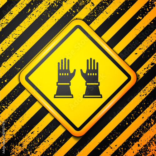 Black Firefighter gloves icon isolated on yellow background. Protect gloves icon. Warning sign. Vector.