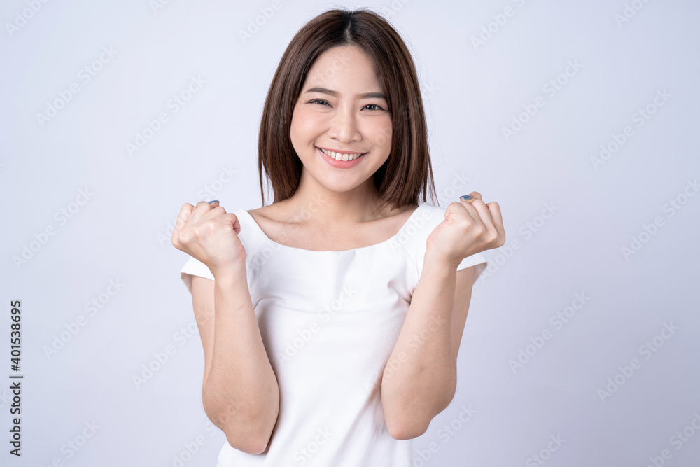 Asian woman poses with a feeling of excitement and joy, Isolated on white background. Asian woman poses with a feeling of excitement and joy, Isolated on white background.