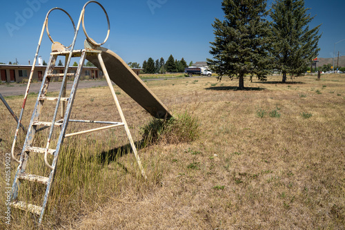 Tablou pe pânză Cokeville, Wyoming - Swingset and playground at an old abandoned seedy motel, wi