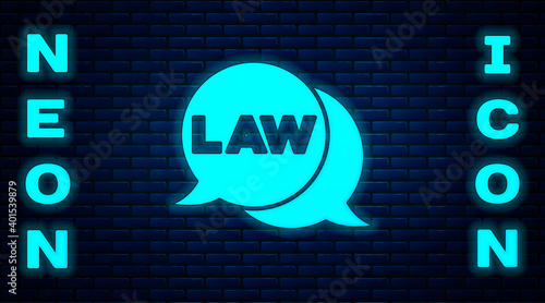 Glowing neon Law icon isolated on brick wall background. Vector.
