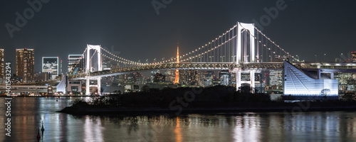 Fototapeta Naklejka Na Ścianę i Meble -  Rainbow Bridge and Tokyo Tower at night viewed from Odaiba　お台場から観たレインボーブリッジと東京タワー 夜景