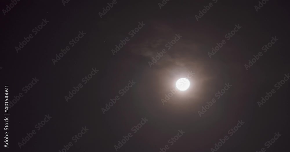 Timelapse of Moon at night in the sky with moving clouds Timelapse of Moon at night in the sky with moving clouds
