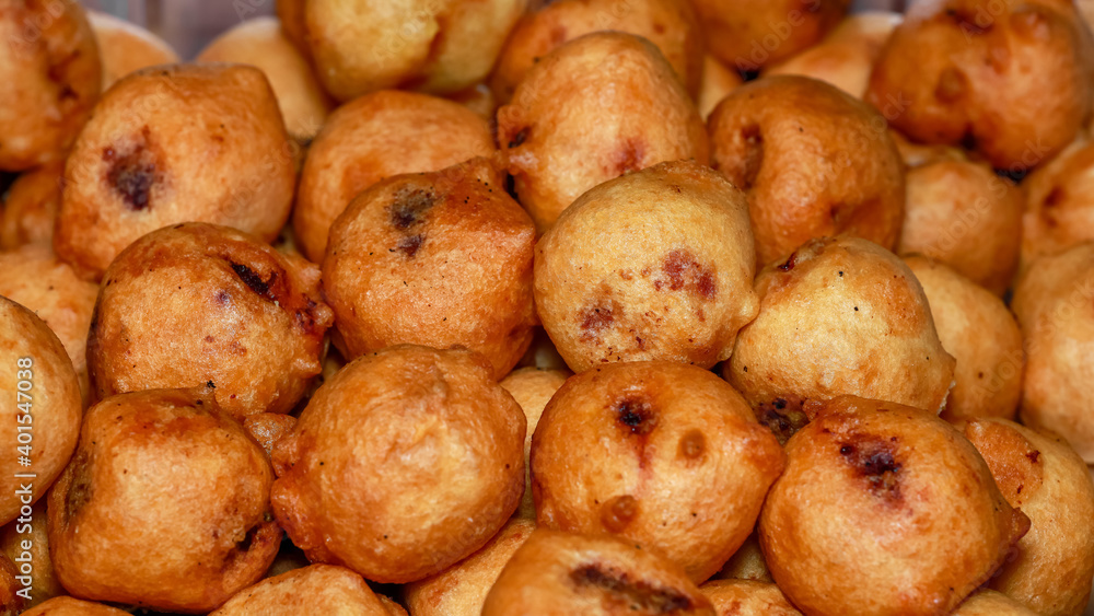 Deep fried traditional Indian dish called poornalu made with jaggery
Deep fried traditional Indian dish called poornalu made with jaggery