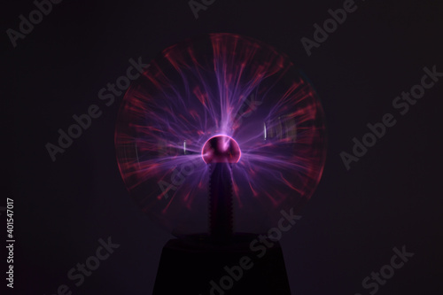 A closeup shot of a colorful plasma ball on a black background photo