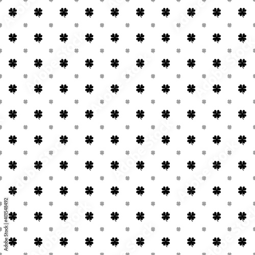 Square seamless background pattern from black four-leaf clover symbols are different sizes and opacity. The pattern is evenly filled. Vector illustration on white background