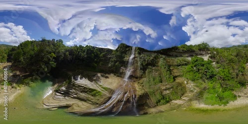 Can-umantad Falls in green forest, aerial drone. Waterfall in the tropical mountain jungle. Bohol, Philippines. 360 panorama VR. photo