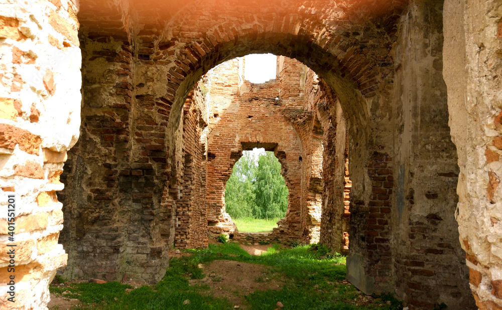 Historical walls on a narrow alleyway. Tourism and Travel concept. Corridors or roads between walls in the old castle. Sunshine.