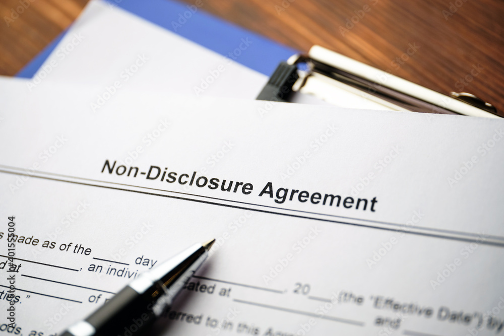 Legal document Non-Disclosure Agreement on paper close up. Legal document Non-Disclosure Agreement on paper close up.