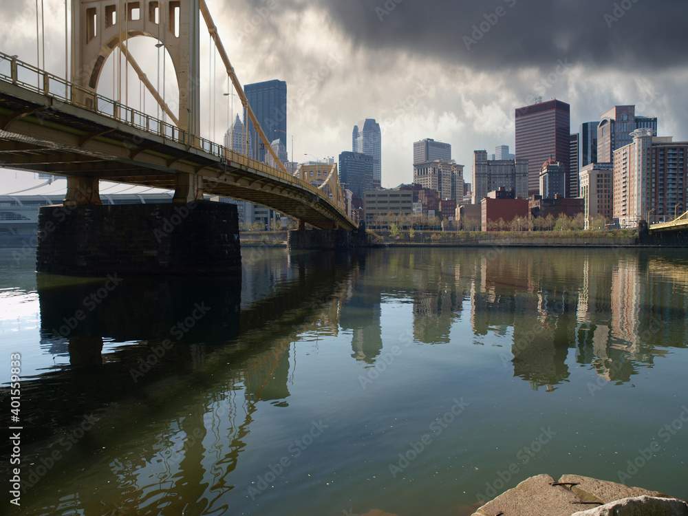 Old river bridge with storm sky in downtown Pittsburgh Pennsylvania.