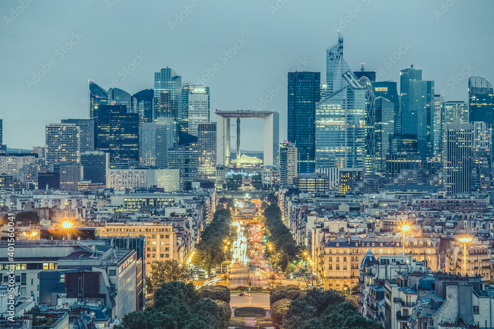 Obraz premium View of La Defence Paris business district from Place Charles De Gaulle at dusk.