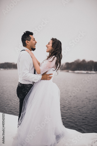 groom and bride wedding love couple in winter in snow