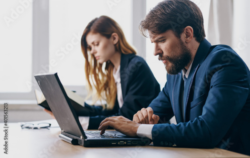 Business man and woman working desk technology internet communication finance office