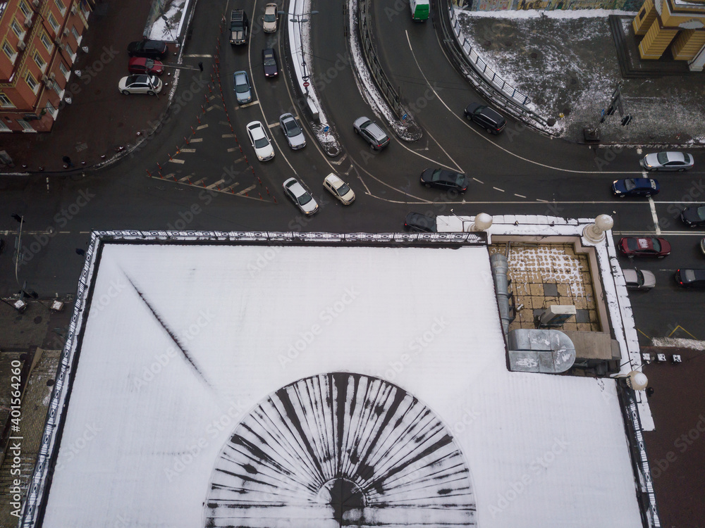 Aerial drone view. Snow covered roof of the house.