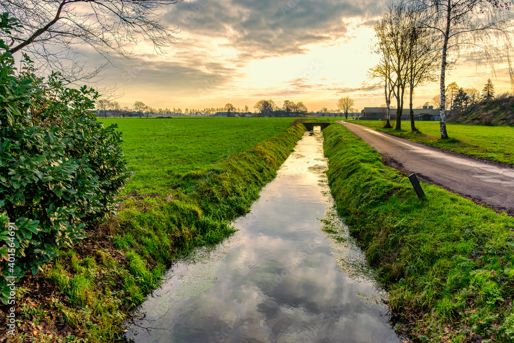 Late afternoon winter view over the slow streaming creek, the Lunterense Beek.⠀ Late afternoon winter view over the slow streaming creek, the Lunterense Beek.⠀