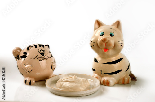 Still life with cats and sour cream