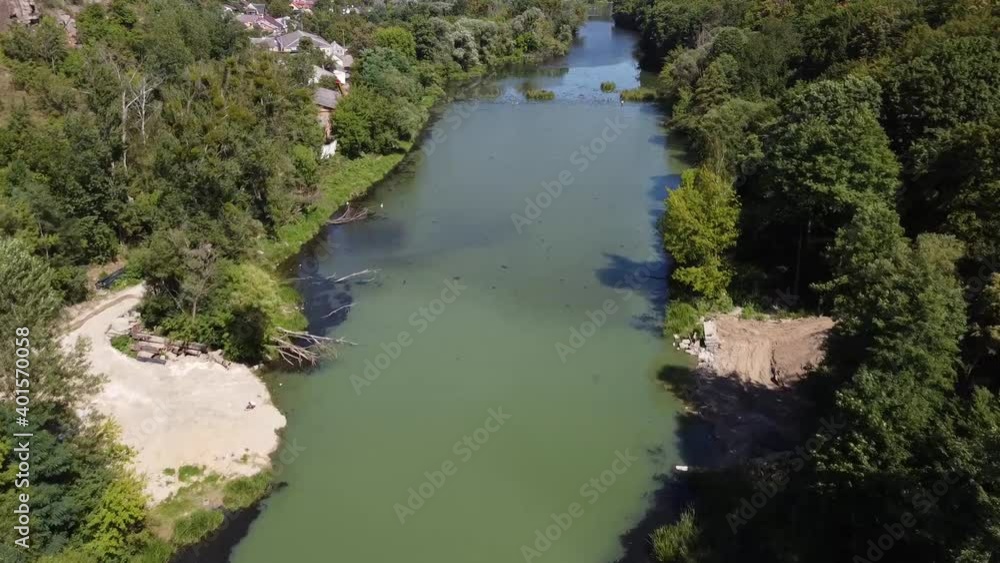 View of the river and trees on the bank. Park near Teteriv River. View from the top. Drone Video. Zhytomyr. Ukraine. Europe View of the river and trees on the bank. Park near Teteriv River. View from the top. Drone Video. Zhytomyr. Ukraine. Europe