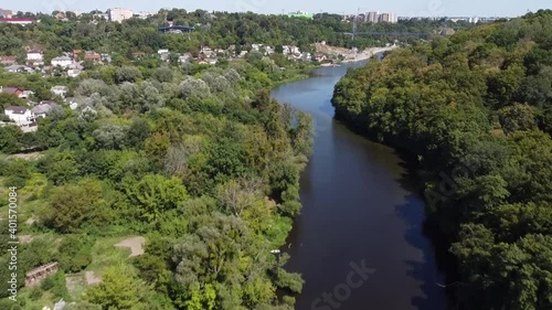 View of the river and trees on the bank. Park near Teteriv River. View from the top. Drone Video. Zhytomyr. Ukraine. Europe photo