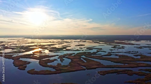Irresistible floods on the Samara River on the Dnieper in Ukraine in the evening warm bright light. Aerial UHD 4K drone realtime video, shot in 10bit HLG and colorized