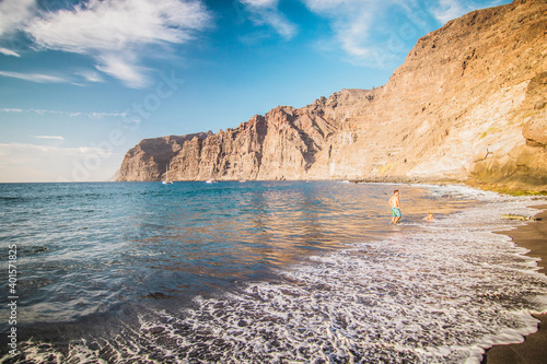 Amazing view of beach in Los Gigantes with high cliffs on the sunset. Location: Los Gigantes, Tenerife, Canary Islands. Artistic picture. Beauty world.