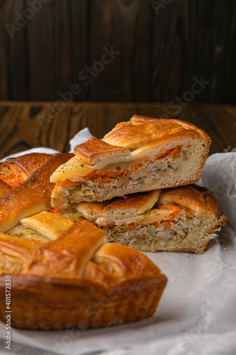 Meat pie on a brown wooden table
