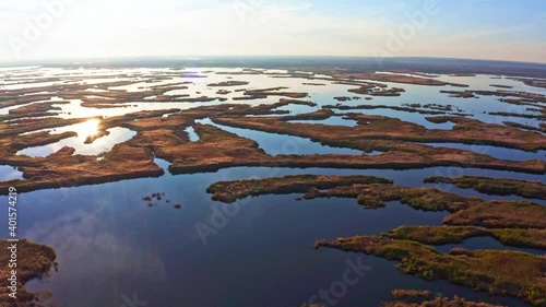 Irresistible floods on the Samara River on the Dnieper in Ukraine in the evening warm bright light. Aerial UHD 4K drone realtime video, shot in 10bit HLG and colorized