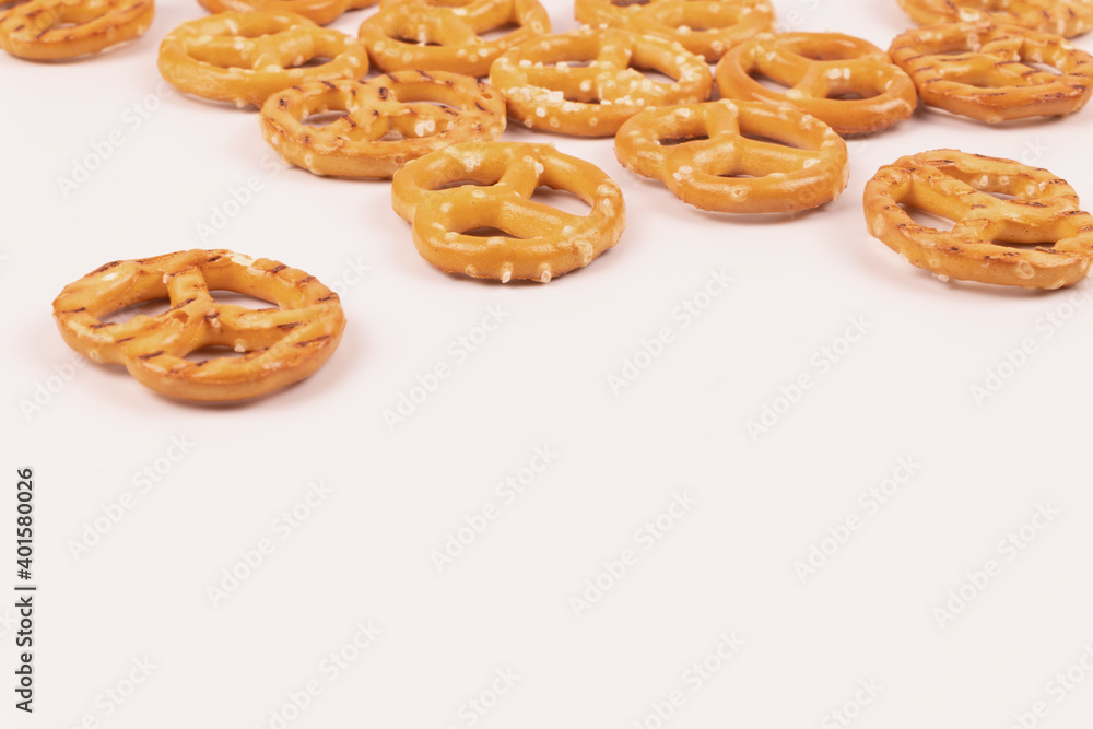 Several salted crackers in the distance on a white background Several salted crackers in the distance on a white background