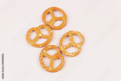 Four salty crackers in the center of a white background