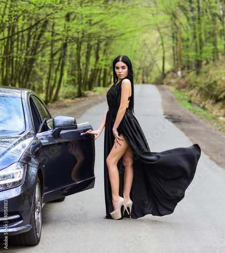 Car and wanderlust girl travel on foot. Transport. Sensual girl travel along road. Road trip. Adventure and discovery. Traveling and wanderlust. Travel is to discover. Fashion model with sensual look © be free