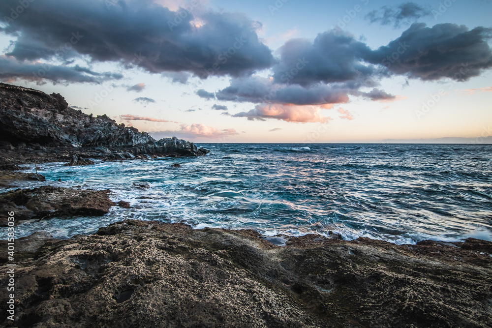 waves breaking on stone reef atlantic ocean on Tenerife island, ocean in motion on Canary islands, Spain. waves breaking on stone reef atlantic ocean on Tenerife island, ocean in motion on Canary islands, Spain.