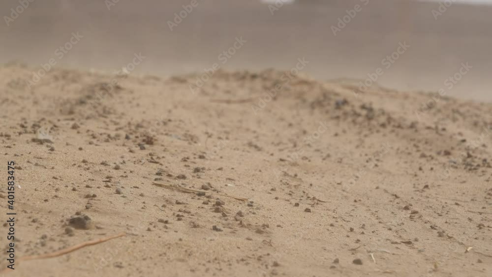 Strong winds cause sandstorms, desert dunes, windy sand landscape, fixed lens Strong winds cause sandstorms, desert dunes, windy sand landscape, fixed lens