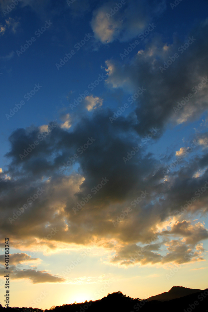 cloud and vanilla sky background with dark mountain silhouette