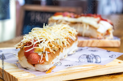 Two venezuelan hot dogs with cheese