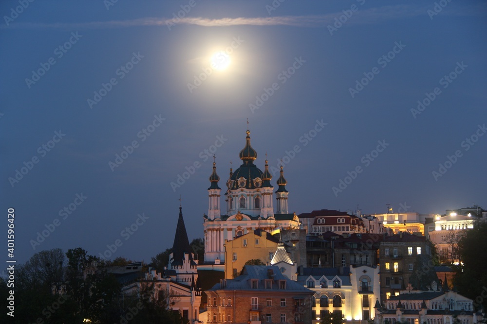 St. Andrew's Church was built in the Baroque style in 1749-1754 by the architect Rastrelli. It is located on Andreevskaya Hill above the historical part of Podol. Full Moon. Kiev city.