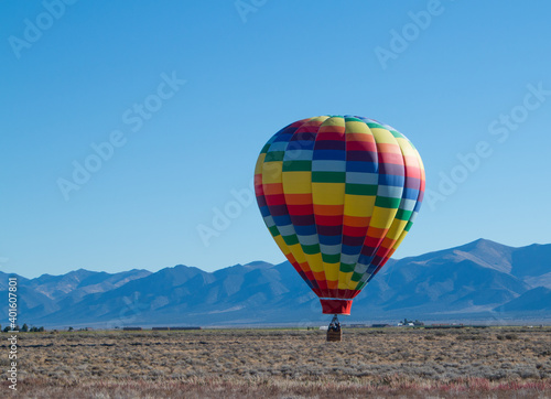 Colorful Hot Air Balloon hovering just above ground