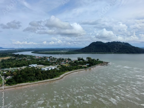 Buntal, Sarawak Malaysia - December 25, 2020: The Beautiful Fishing Village of Buntal at Sarawak Malaysia, beside the South China Sea, with the mighty Mount Santubong as the background photo