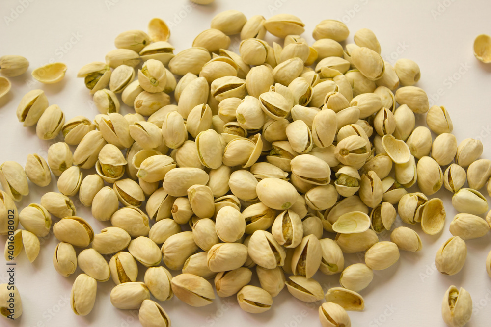 close up Pile of Pistachios isolated on white background. close up Pile of Pistachios isolated on white background.