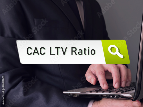  Financial concept meaning Customer Lifetime Value  CAC LTV Ratio Customer Acquisition Cost with sign on the sheet.