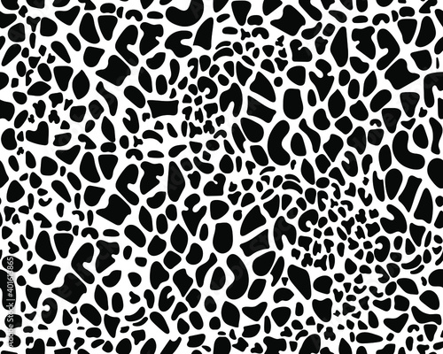 Seamless giraffe fur pattern. Black and white texture of animal skin. Abstract vector design for web, fabric, interior. Fashionable color combination. Dalmatian dog spots.